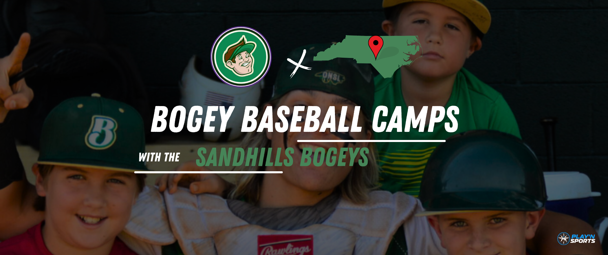Promotional banner for Bogey’s Baseball Camp hosted by the Sandhills Bogeys. The background features smiling kids in baseball gear, including one in a catcher's chest protector and eye black. Overlaid text reads “Bogey’s Youth Baseball Camp with the Sandhills Bogeys.” The image also includes a Sandhills Bogeys logo, a red location pin on a North Carolina state map, and a Play’n Sports logo in the bottom right corner.